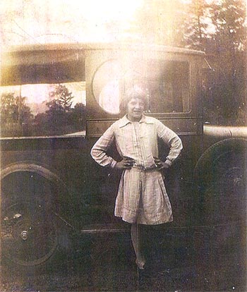Velma Seaman, daughter of businessman Andy Seaman, standing in front of their modern delivery truck, which replaced the horse-and-buggy shown in the top photo.