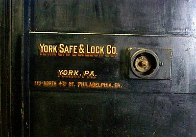 These photos show two safes (one in the basement and one on the first floor) installed in the "new" Penn Mary office building circa 1910-11. Both safes were walk-in types and were used for payroll and records storage. The safes are located near the center of the building and stacked on top of each other, with walls about 14"-18" thick.